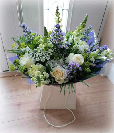 Cool Breeze - This classical stylish collection of flowers, make this hand tied the perfect gift. Flowers professionally arranged and delivered by a local florist.