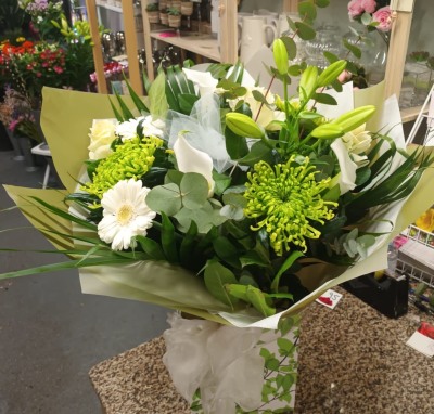 Evelyn - A fabulous collection of white and cream flowers make this the perfect gift. This bouquet will be hand delivered by the local florist.