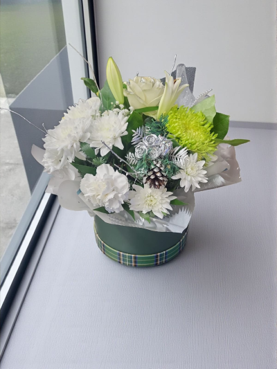 Christmas Hatbox - A collection of white flowers in a hatbox.